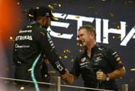 Lewis Hamilton (L) and Christian Horner (R) at the podium during the 2021 F1 Grand Prix of Abu Dhabi - Source: Getty